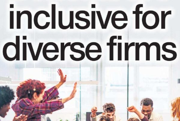 Banner with the headline “Benefits are inclusive for diverse firms” overlaid on an image of a diverse modern office team engaged in discussion, with inclusive signage and wellness posters.