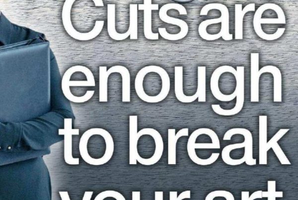 Banner showing a dramatic spotlight on a stage with an empty chair and a broken paintbrush beside it, titled “Cuts are enough to break your art”.