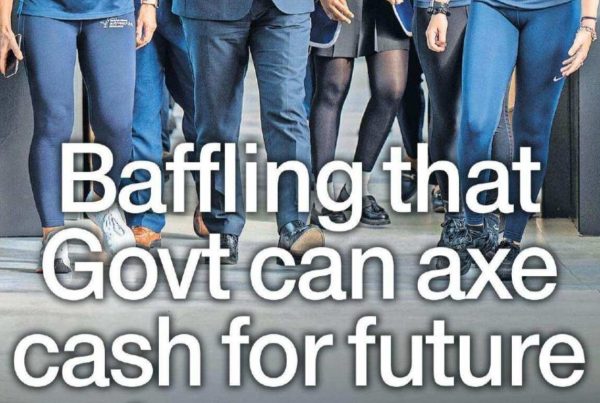 Banner image of a closed classroom door with a business plan poster hanging beside it. Headline text overlay reads: “Baffling that Govt can axe cash for future entrepreneurs”.