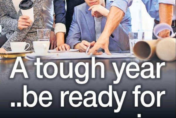 Banner image of stormy clouds over a city skyline with a distant glimmer of light, overlaid with the headline “A tough year ..be ready for same again” and a photo of Shaf Rasul looking reflective.