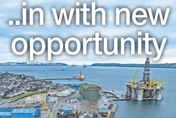 Banner image of a rising sun over a field of wind turbines and solar panels, symbolising transition and new opportunity, with the headline “Out with old...in with new opportunity” and a portrait of Shaf Rasul. Title: Out with old...in with new opportunity