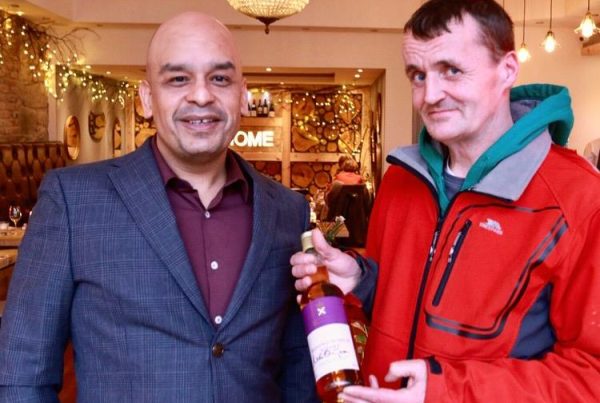 Shaf Rasul receiving prize for top fundraiser at Social Bite’s CEO Sleepout