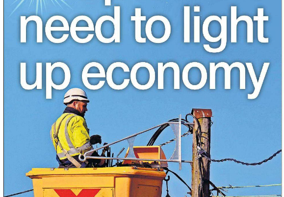Headline graphic reading “Spark we need to light up economy” over a background image of rural electricity pylons or a countryside landscape with transmission infrastructure.