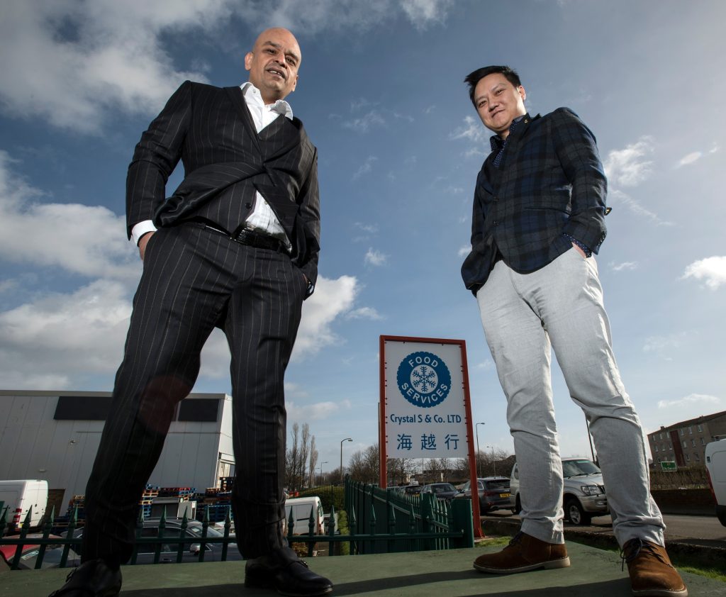 Shaf Rasul with tenant outside the newly acquired Sighthill property in Edinburgh