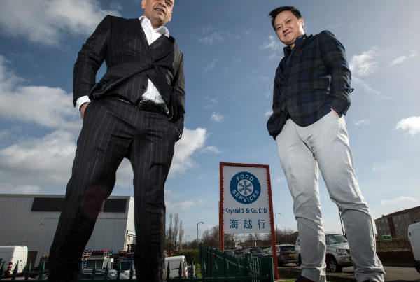 Shaf Rasul with tenant outside the newly acquired Sighthill property in Edinburgh