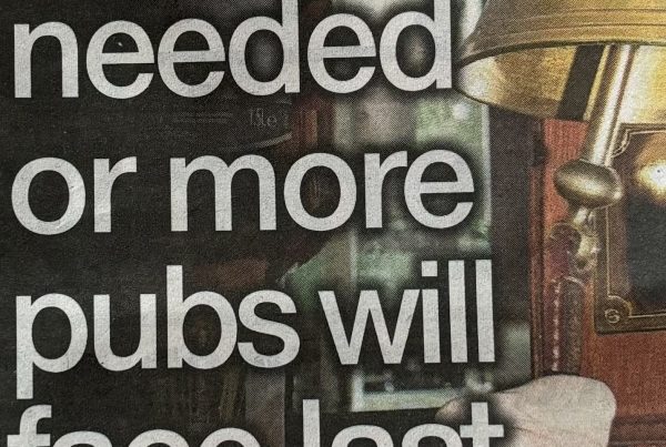 A dimly lit pub interior with empty chairs and a "Last Orders" sign on the bar, evoking a sense of closure; headline text overlaid reads: “Action needed or more pubs will face last orders”