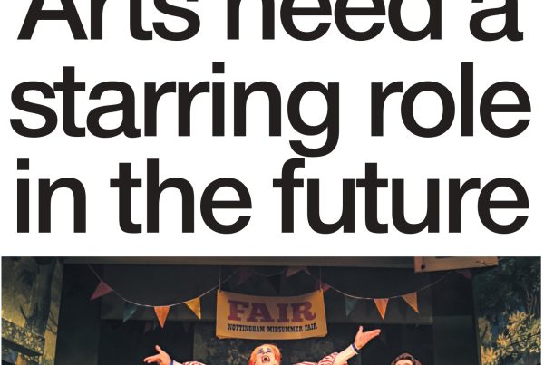 Shaf Rasul in front of a stage curtain backdrop with theatrical masks, spotlights, and bold text reading “Arts Need a Starring Role in the Future”