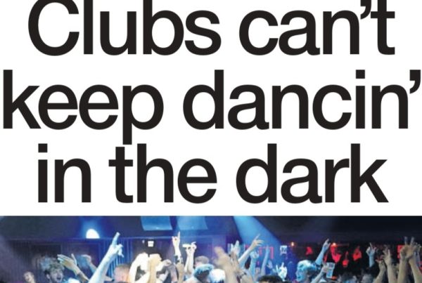 A deserted Scottish nightclub dancefloor with dimmed lights and a mirror ball, symbolising the pandemic shutdown and calls for reopening.