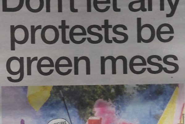 Banner with “Don’t let any protests be green mess” as the headline, overlaid on an image of Glasgow’s SEC with protest signs and climate slogans visible in the distance.