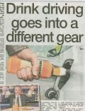 A column header featuring the headline “Drink driving goes into a different gear” with images of whisky barrels, a car dashboard, and biofuel graphics.