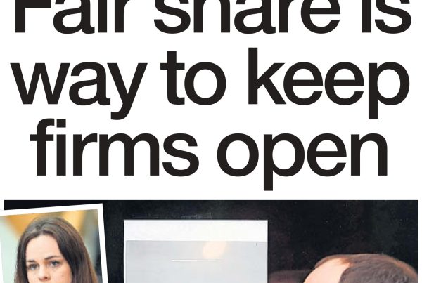 A shuttered high street shop with a government support poster in the window, alongside an open laptop displaying a digital grant form. Headline reads: “Fair share is way to keep firms open.”