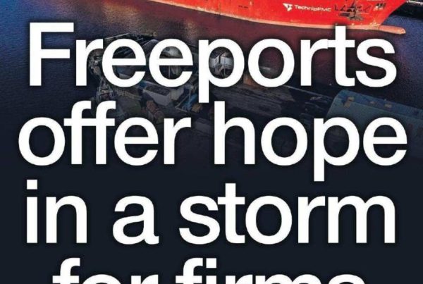 Banner showing the headline “Freeports offer hope in a storm for firms” over an image of a windswept Scottish coastline with shipping containers and cranes symbolising Freeport zones.