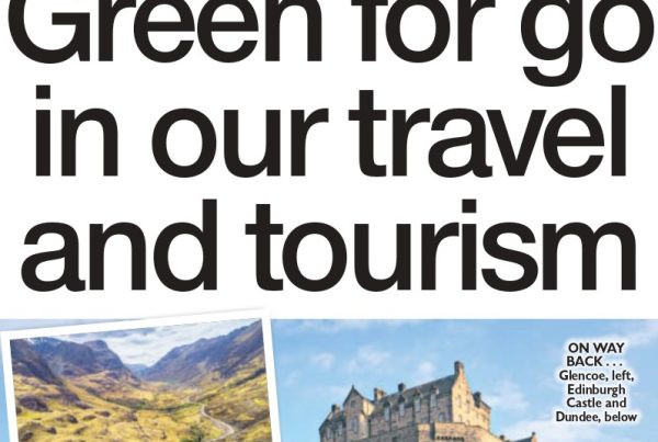 A scenic Scottish highland landscape with an electric bus and suitcase by a road, with text overlay: “Green for go in our travel and tourism”