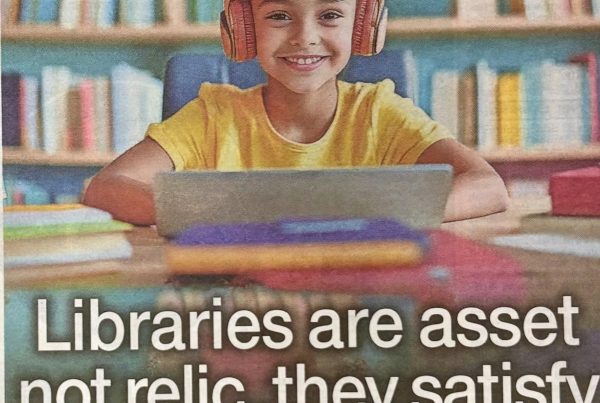 Headline graphic reading “Libraries are asset not relic…they satisfy curiosity, offer new skills & need saved” placed over an image of a smiling child in a library using a laptop