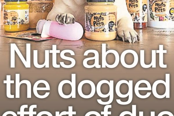 Shaf Rasul with the headline “Nuts About the Dogged Effort of Duo” next to a photo of dog treats and happy dogs, symbolising the Nuts for Pets entrepreneurial success.