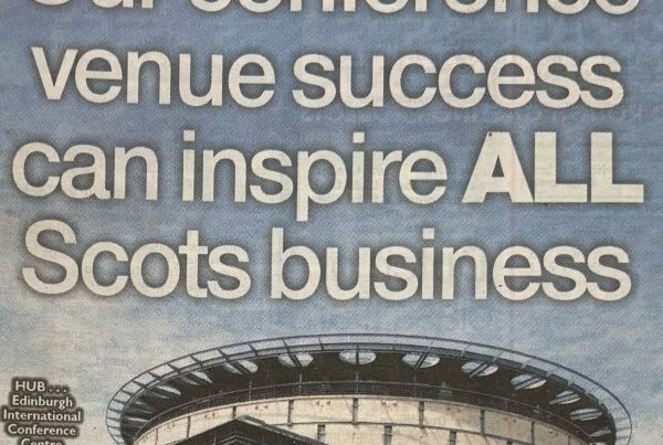 A wide-angle shot of the Edinburgh International Conference Centre with a superimposed graph rising behind it and crowds of delegates outside. Bold headline text reads: “Our conference venue success can inspire ALL Scots business”.