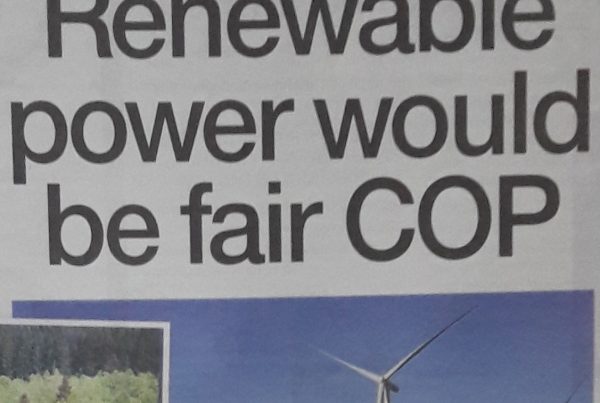 Illustration of Glasgow skyline with a COP26 banner, wind turbines and solar panels in the foreground, and timber-framed homes to the side. Headline reads: “Renewable power would be fair COP.”