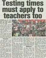A generated image with the headline “Testing Times Must Apply to Teachers Too” embossed over visuals of a classroom, a teacher’s desk, and piles of paperwork.
