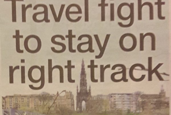An image showing a near-empty train platform with a “Reduced Service” notice, next to a cyclist commuting through a busy urban street. Headline text reads “Travel fight to stay on right track.”