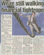 A banner image featuring the headline “We’re Still Walking a Financial Tightrope” with visuals of a tightrope walker over a cityscape, balancing symbols of money, debt, and businesses in the background.