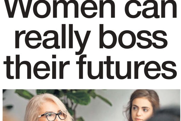 A confident woman standing with arms folded in a business setting, overlaid with the headline “Women can really boss their futures”