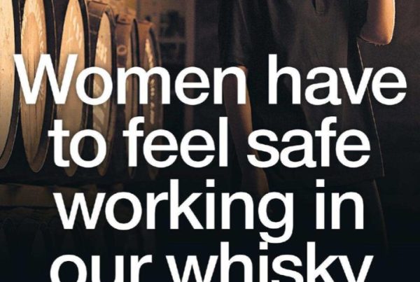 Banner image featuring a whisky distillery backdrop with bold text reading “Women Have to Feel Safe Working in Our Whisky Businesses”, with female workers in the background symbolising diversity and inclusion.