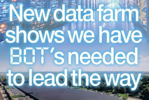 A futuristic data-centre corridor lined with server racks glowing blue, overlaid with the headline “New data farm shows we have BOT’s needed to lead the way.”