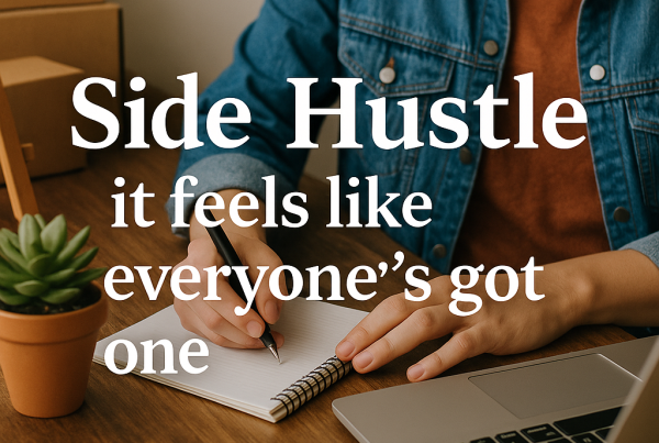 Person working at a desk with a laptop and notepad, with the headline "Side Hustle – it feels like everyone’s got one" overlaid in bold white text.