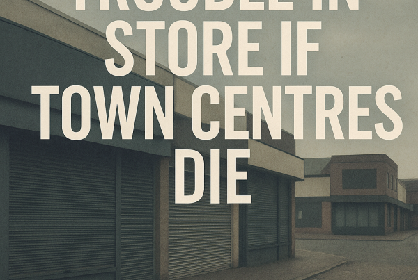 A desolate town centre with shuttered shopfronts under grey skies, overlaid with bold white text reading “TROUBLE IN STORE IF TOWN CENTRES DIE.”