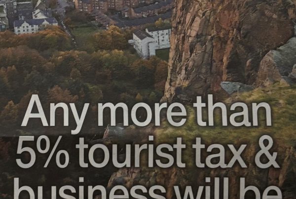 A newspaper column headline reading “Any more than 5% tourist tax & business will be Edin for cliff edge,” with accompanying image of Edinburgh’s skyline or tourist-heavy streets.