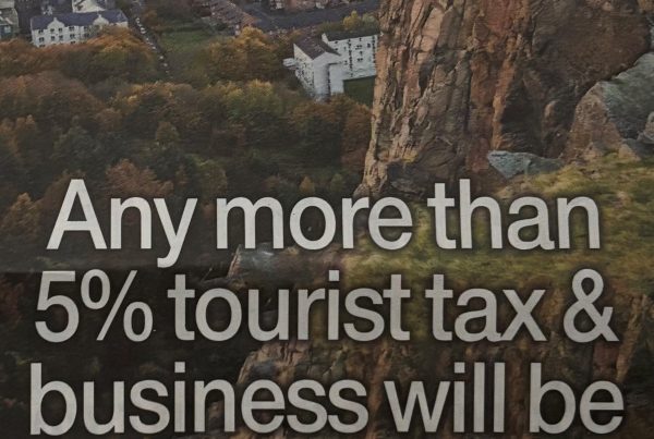 A newspaper column headline reading “Any more than 5% tourist tax & business will be Edin for cliff edge,” with accompanying image of Edinburgh’s skyline or tourist-heavy streets.