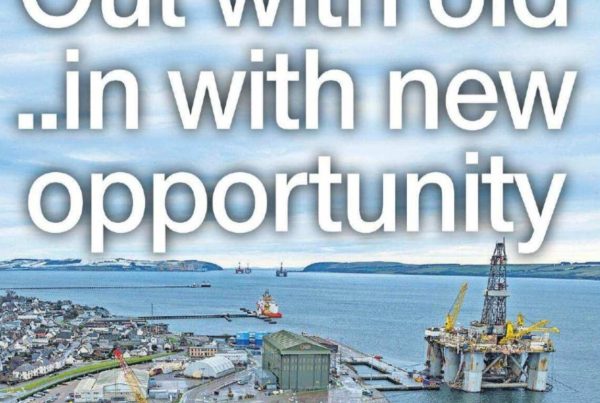 Banner image of a rising sun over a field of wind turbines and solar panels, symbolising transition and new opportunity, with the headline “Out with old...in with new opportunity” and a portrait of Shaf Rasul. Title: Out with old...in with new opportunity