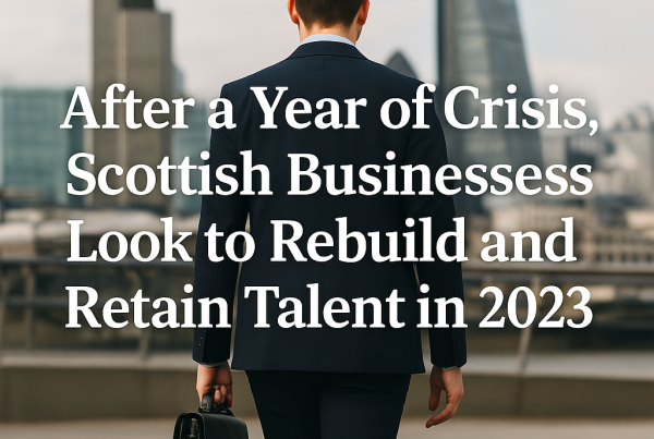 A businessman in a dark suit walks toward a city skyline, carrying a briefcase, with the headline "After a Year of Crisis, Scottish Businesses Look to Rebuild and Retain Talent in 2023" overlaid in bold white text.