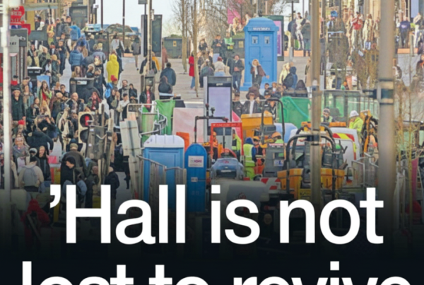 Daytime photo of Sauchiehall Street packed with pedestrians, street works and barriers down the centre, overlaid with large white headline text reading “’Hall is not lost to revive iconic street.”