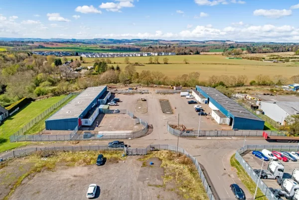 Drone aerial view of the industrial estate on Nobel Road, Wester Gourdie Industrial Estate, Dundee, showing Blocks 11 and 12 and surrounding yard space.